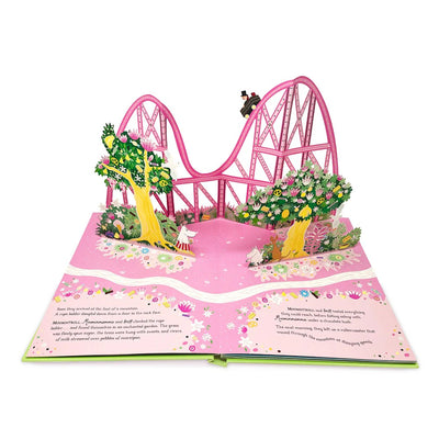 Pop-up book with a pink roller coaster and flowers on a white background