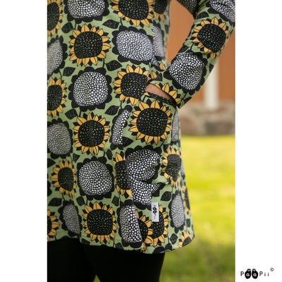 Hand in pocket of sunflower tunic