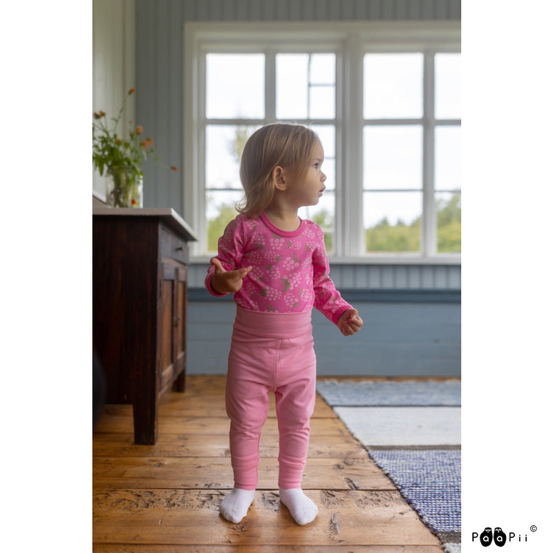 Toddler wearing pink Jenkka onesie