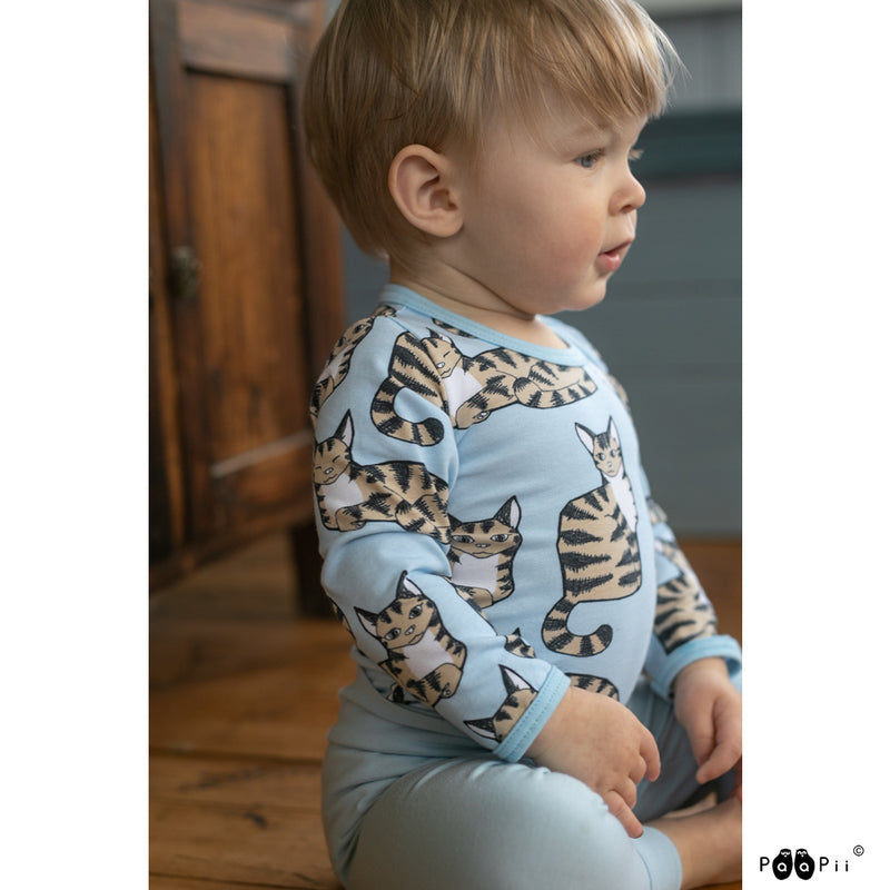 Toddler wearing onesie with cats pattern