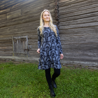 woman in gates of pohjola dress wearing black leggings