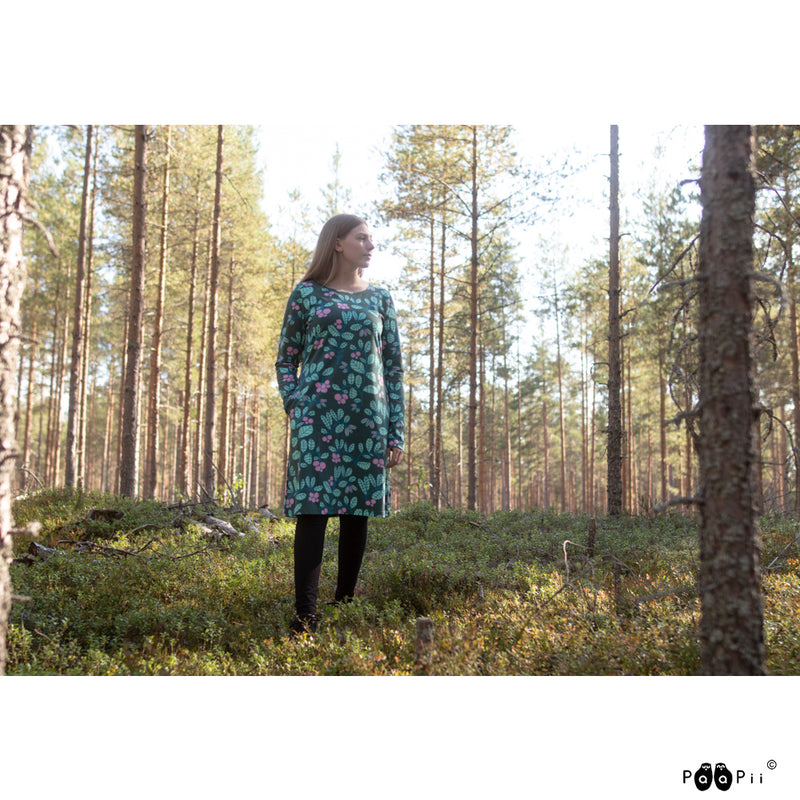 Woman in woods wearing Paapii Sini Dress Lingonberry