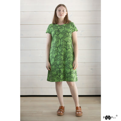 Woman wearing dress with alder pattern