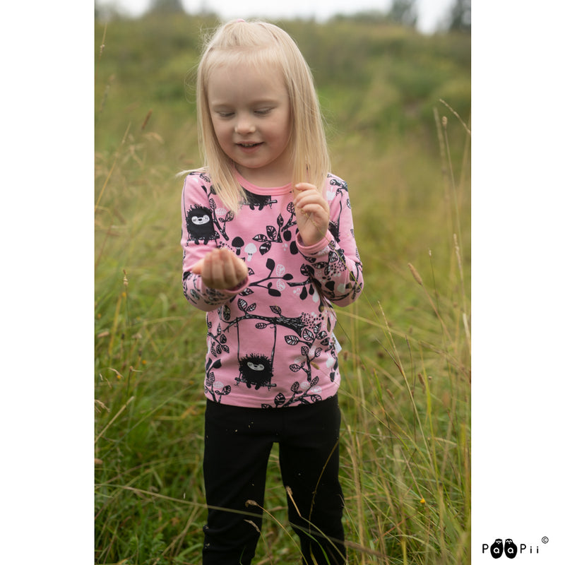 Child wearing long sleeved siiri in the swing shirt