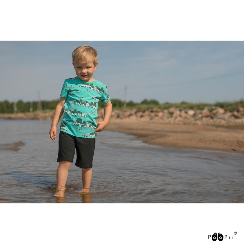 Kid at beach wearing Visa Archipelago shirt