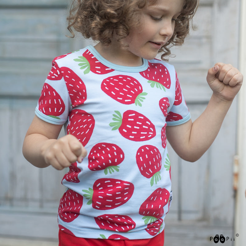 Kid wearing Paapii Polka shirt with stawberries