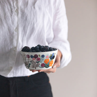Pentik Metsämarja Soup / Cereal Bowl holding berries