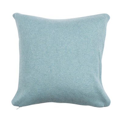 Light blue cushion on a white background