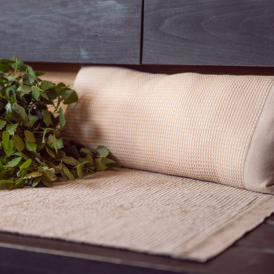 Seat cover and cushion displayed on sauna bench