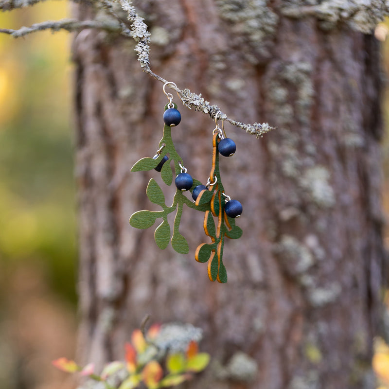 Aarikka Mustikka Earrings hanging from tree branch