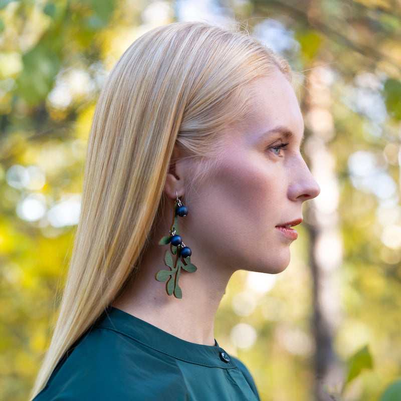 woman wearing Aarikka Mustikka Earrings