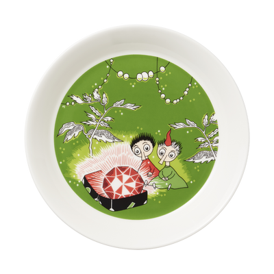 Round plate with cartoon characters and a red gemstone on a green background