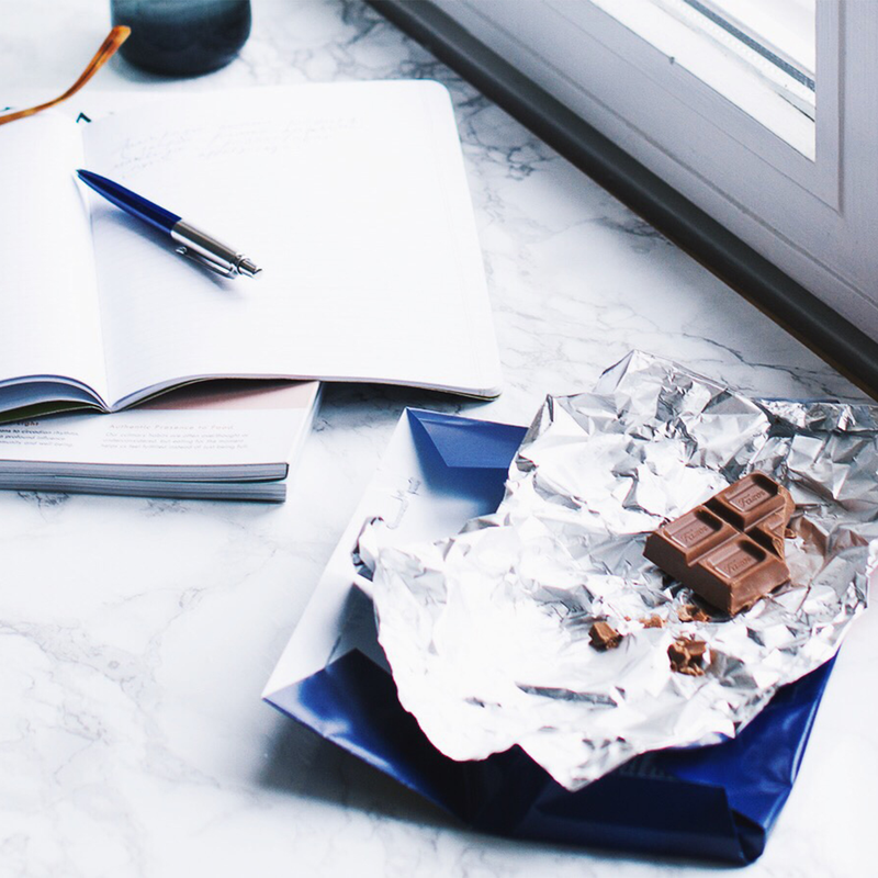 fazer milk chocolate bar unwrapped on desk