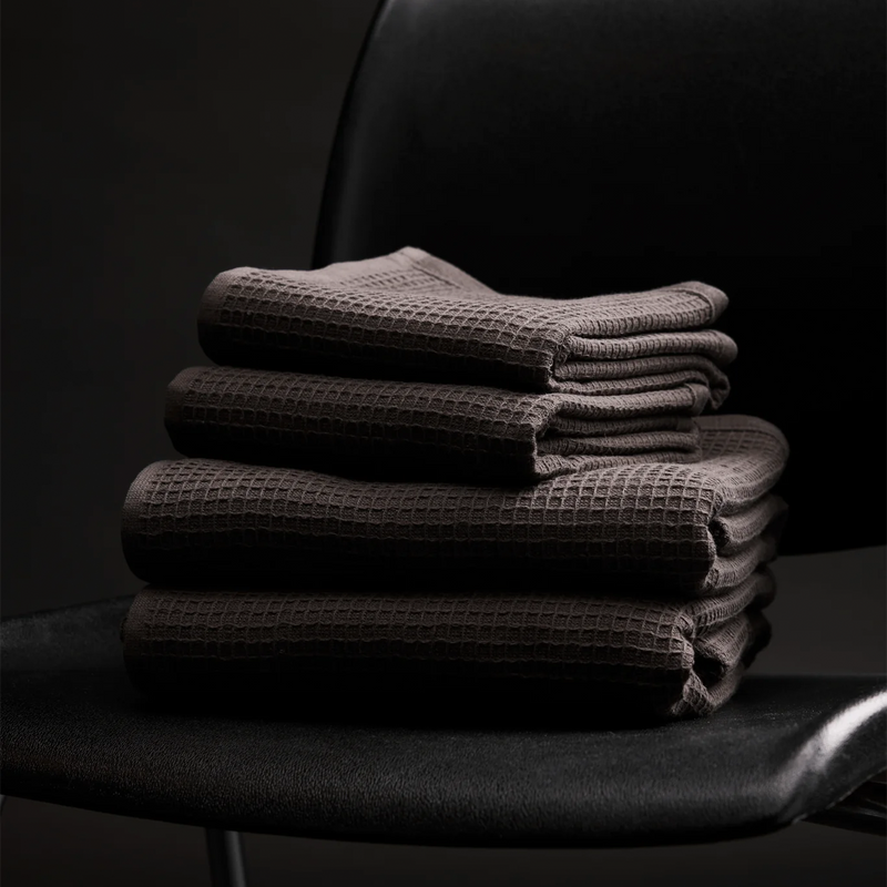 folded bath towels on chairs