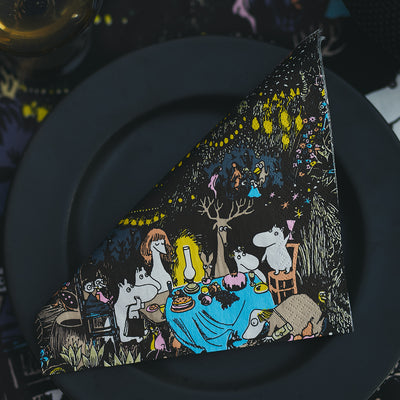 Decorative napkin with cartoon characters on a dark plate