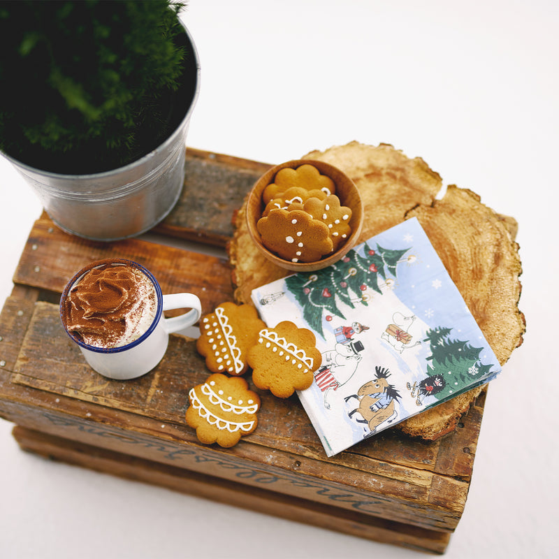 Wooden tray with cookies, a cup of coffee, and a Christmas-themed card on a white background