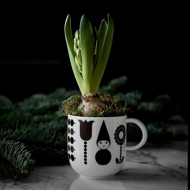 Aarikka Puisto Elf Mug holding onion bulb as decor