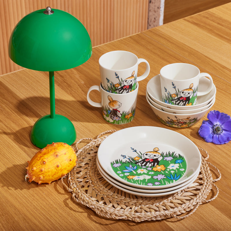 Arabia Moomin Little My and Meadow dinnerware stacked on table