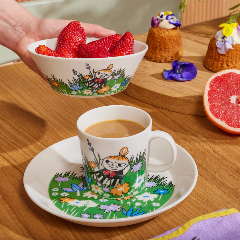 Arabia Moomin Little My and Meadow dinnerware on table with strawberries and coffee