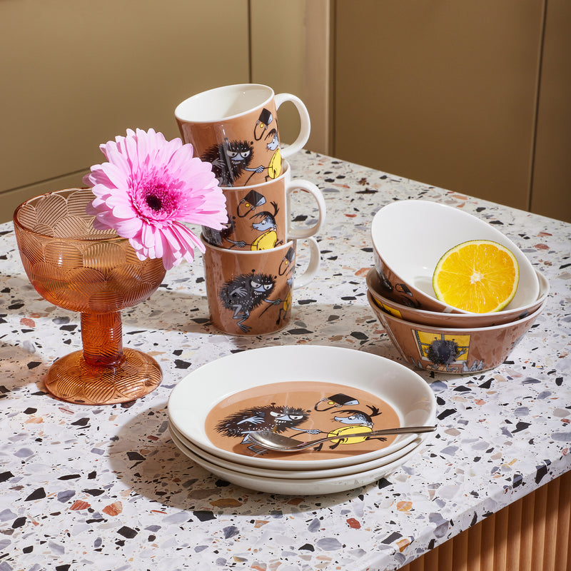 Arabia Moomin Stinky in Action dinnerware collection on table
