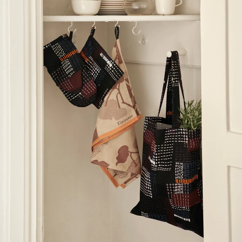 Finlayson Alku kitchen towels hanging in closet