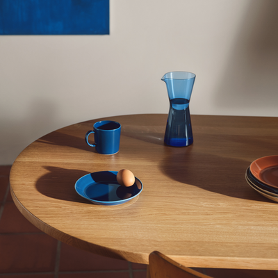 iittala ultramarine blue glass and dinnerware on table