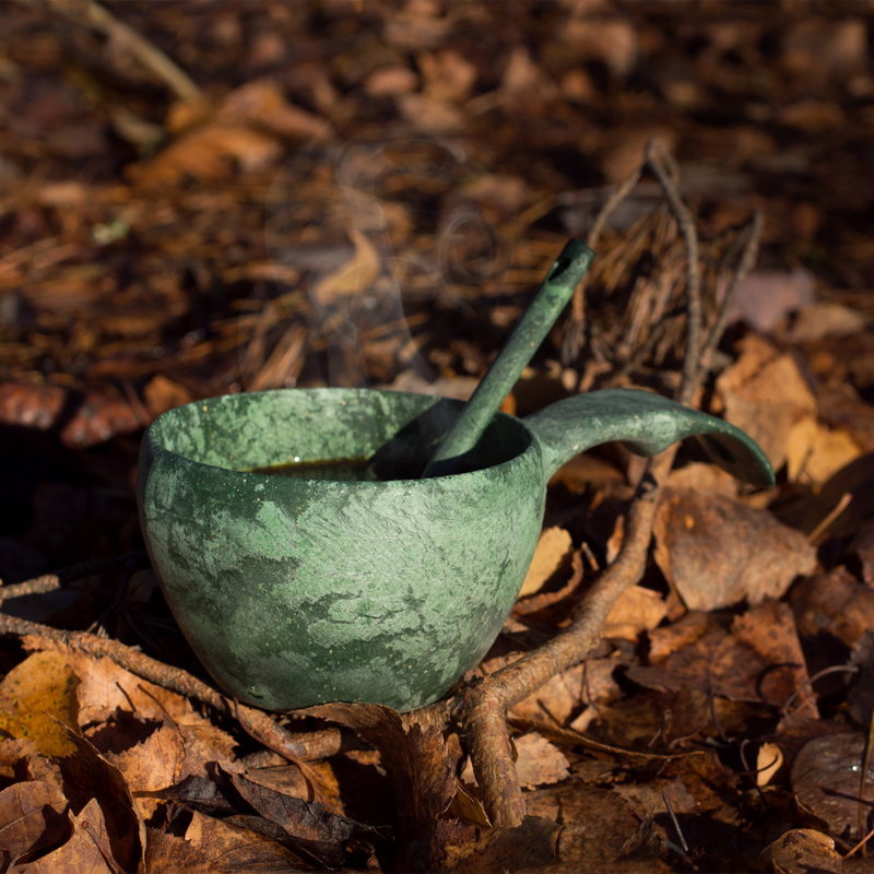 Kupilka Classic Cup in conifer color sitting on woods floor