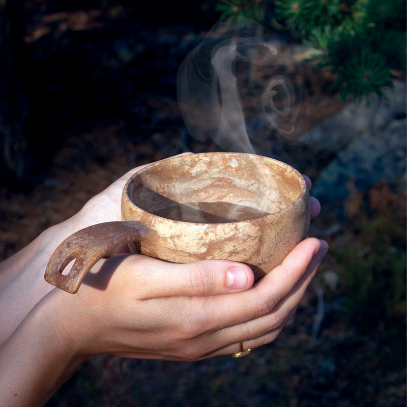 Kupilka cup with steaming liquid inside