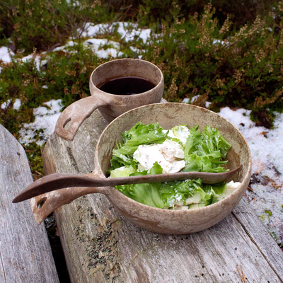 Lettuce salad in Kupilka bowl with coffee in Kupilka cup