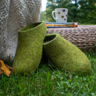 Relaxing in field with Lahtiset slippers Lime Green