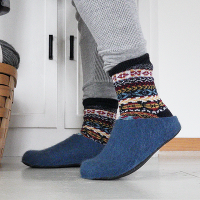 Standing up wearing Lahtiset Slippers with socks in house