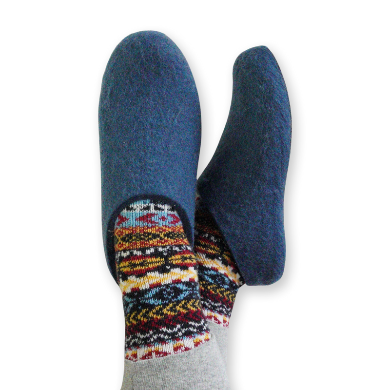 Feet crossed wearing Lahtiset Petrol Blue Felt Slippers w/ Rubber Sole 