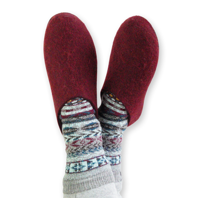 Crossed feet wearing Lahtiset Felt Slippers w/ Rubber Sole, Plum Red