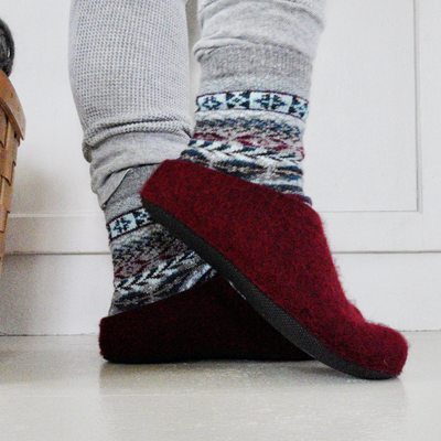 Person wearing Lahtiset Felt Slippers w/ Rubber Sole, Plum Red in house
