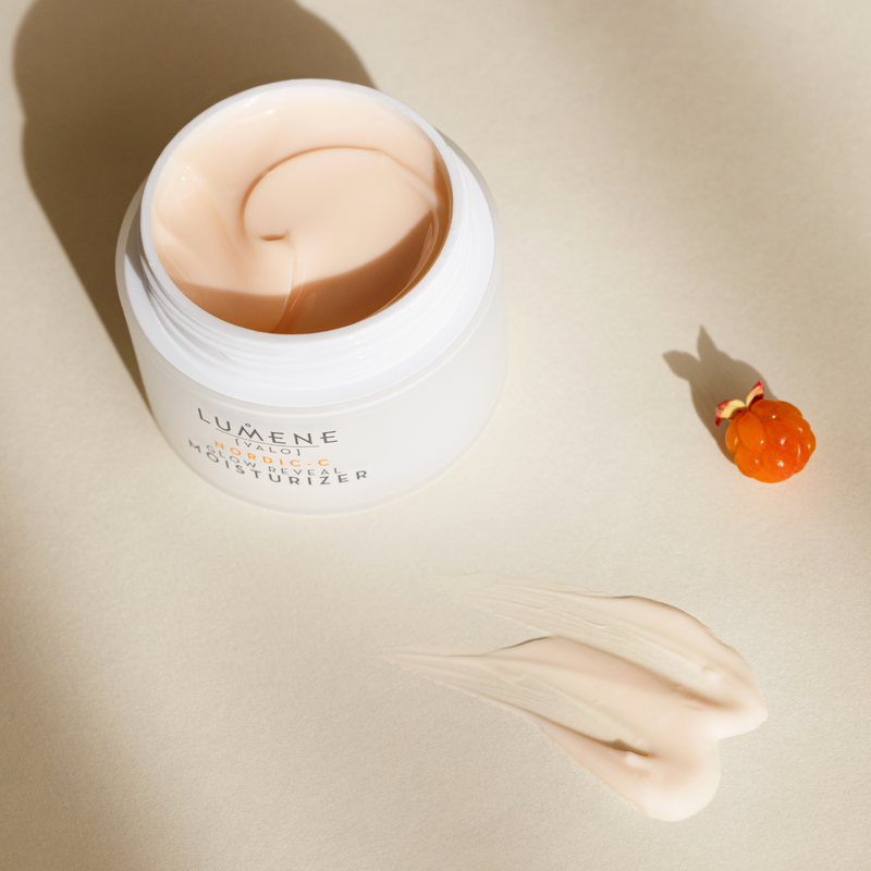 Jar of Lumene moisturizer open with some smeared on table