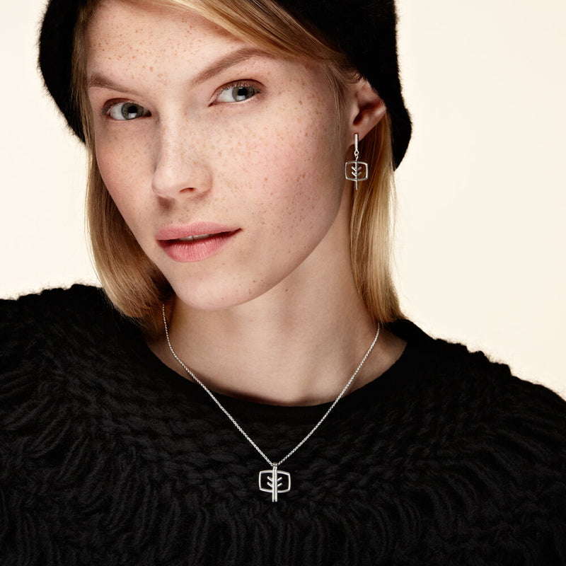 women wearing Chao & Eero Mänty Necklace and earrings