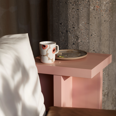 Marimekko white/beige/pink Unikko Mug on bedside table