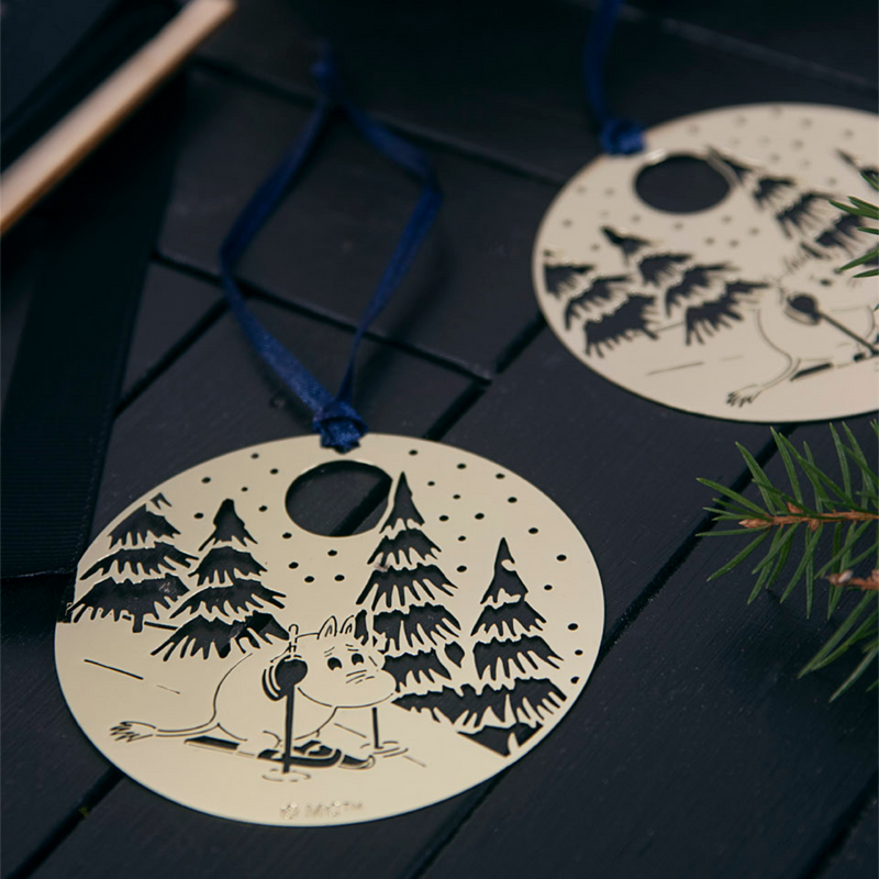 Two matching Moomin Skiing Metal Ornament displayed on black surface