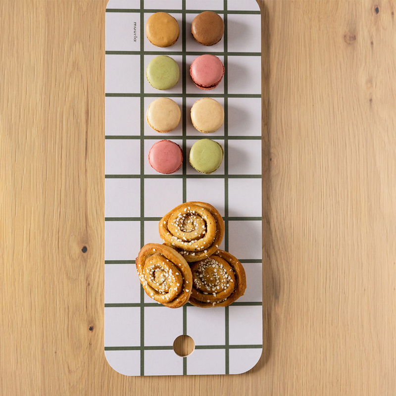 Rolls and macaroons on chop and serve board