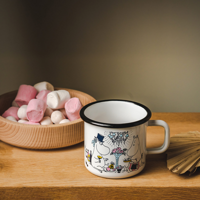 Muurla Moomin Date Night Enamel Mug on table with candy dish