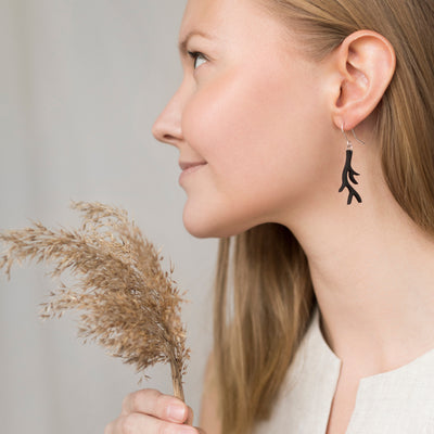 Woman modeling Valona Antler Birch Earrings, Black