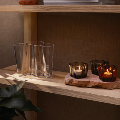 iittala Alvar Aalto Clear Vase on shelf accented by candleholders
