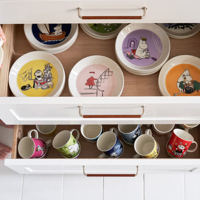 Arabia dinnerware stored in cabinet 