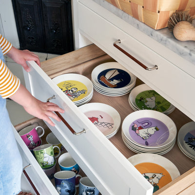 storage drawer full of arabia moomin dinnerware