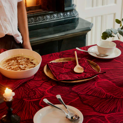 table setting featuring red Finlayson Elämän linens