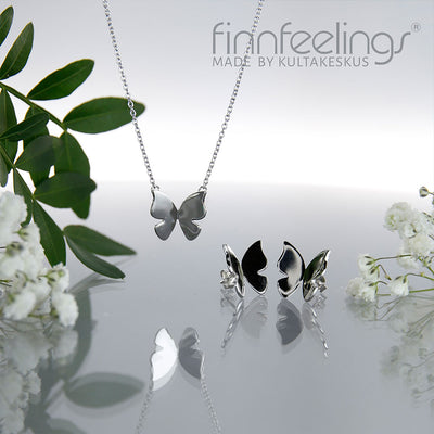 FinnFeelings Butterfly Silver Jewelry with flowers background