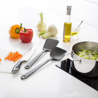 GastroMax Chef's Wok Spoon on countertop with other food prep items