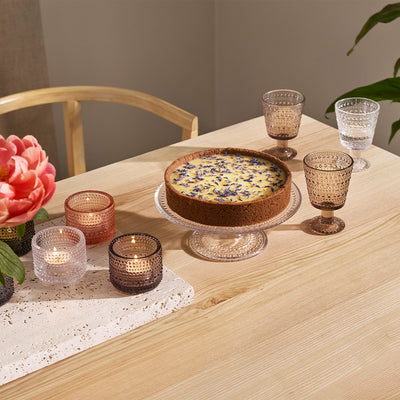 tabletop with kastehelmi glasses, votives and cake stand