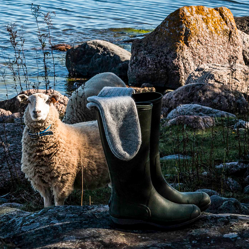 Helsinki Woolen Socks, Lichen Grey on top of swamp boots