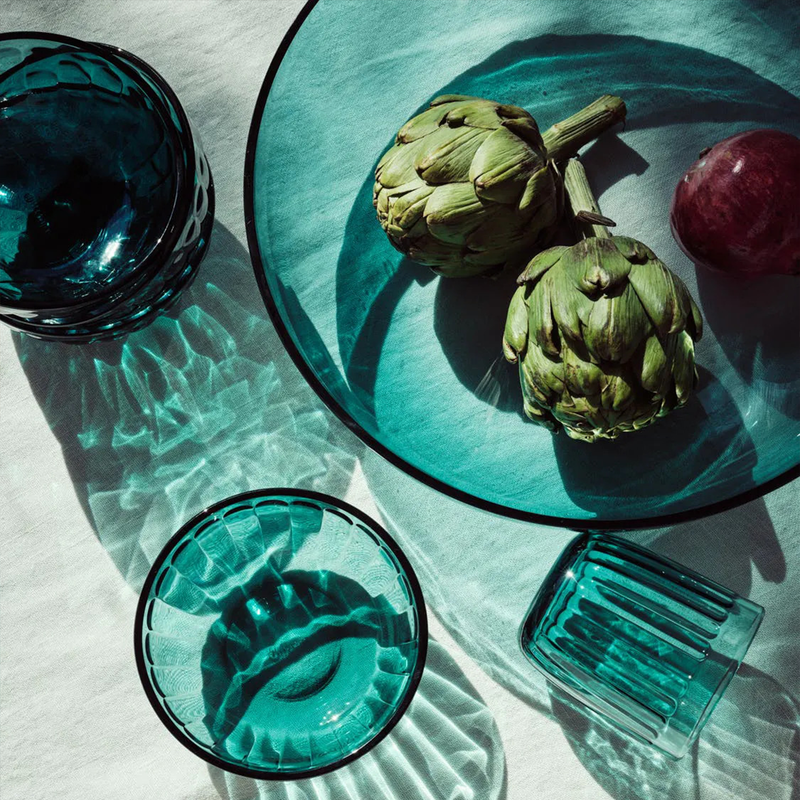 iittala Raami Sea Blue Glass with light shining through
